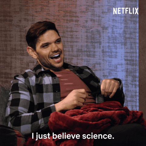 Reality TV gif. Kyle from Love Is Blind leaning back in a chair and twisting a pen, saying, "I just believe in science."