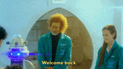 TV gif. Jon Gries as Dr. Roberts in Dream Corp LLC wears a turquoise lab coat in a futuristic facility and smiles kindly at Nicolas Rutherford playing Patient 088, who appears to have just woken up from a procedure with a tube going through his nose. Gries says, "Welcome back," which appears as text.