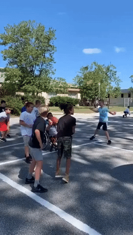 Elementary School Plays Inclusive Basketball Game With Student in Wheelchair