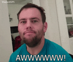 Video gif. A bearded young man tilts his head back in a sappy, over-the-top reaction to something sweet. Text: A drawn-out "Aww!"