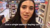 A Single Woman Buying Cat Food
