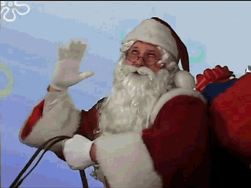 Video gif. Santa Claus waves a gloved hand as he merrily smiles and shakes his head.