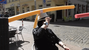 German Cafe Introduces Pool-Noodle Hats to Demonstrate Social Distancing