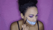 cheshire cat halloween costume GIF by StyleHaul