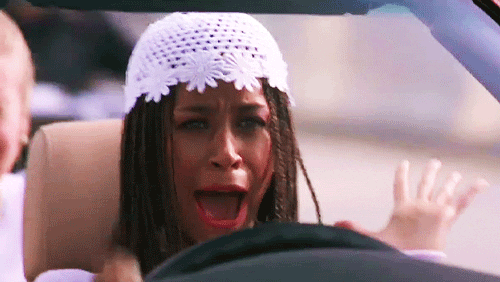 Movie gif. Behind the wheel of a car, Stacey Dash as Dionne in Clueless screams while letting go of the wheel.