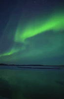 Aurora Borealis Glows Over River in Alaska