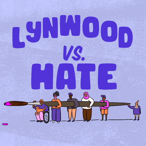Digital art gif. Big block letters read "Lynwood vs hate," hate crossed out in paint, below, a diverse group of people carrying an oversized paintbrush dripping with pink paint.