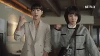 TV gif. Park Eun-bin as Young-woo and Ha Yoon-kyung as Su-yeon in Extraordinary Attorney Woo. Both of them are in the office reporting to a higher up and each of them pump a fist out in cheer and encouragement.