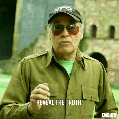 TV gif. A man on UFO Hunters looks at us with tinted sunglasses on. He has a serious expression as he uses his hand to emphasize his words. He says, “Reveal the truth!”