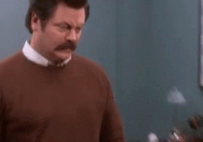 Parks and Recreation gif. Nick Offerman as Ron stares off into space, then shakes his head and looks at us, asking, "What the hell just happened?" which pops up as text.