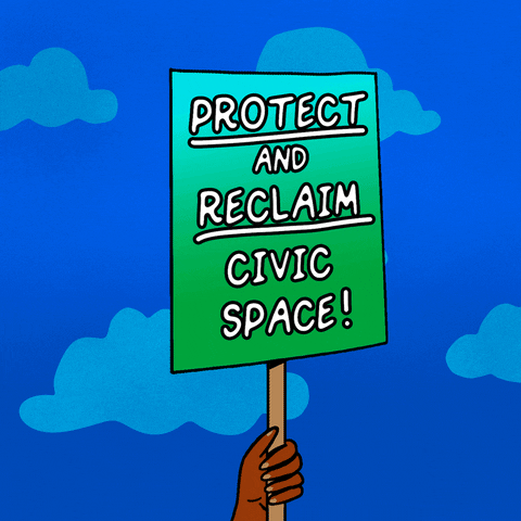 Digital art gif. Hand holds up ablue and green protest sign against a blue background with floating clouds that reads, “Protect and reclaim civic space!”