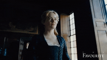 Movie gif. Emma Stone as Abigail in The Favourite walks through a hall, cringing.