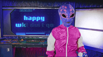 Video gif. A purple alien in a pink jumpsuit looks around itself, weary. Screen in background reads "Happy Wednesday."