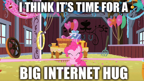 Gif of a group of colourful My Little Ponies having a big hug with text: I think it's time for a big internet hug