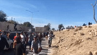 Migrants Vault Over Highway Fence in Tijuana After US Federal Authorities Launch Tear Gas