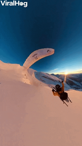 Paraglider Flies And Skis Over Golden Hour Mountains GIF by ViralHog