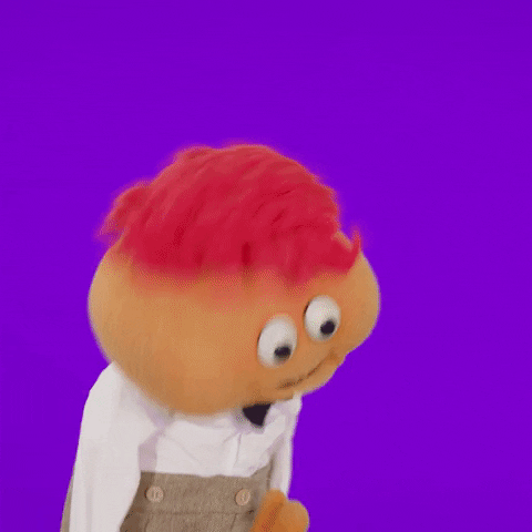 TV gif. Gerbert the puppet holds up his hand in excitement as leans his head back and exclaims, "It's Wednesday!"