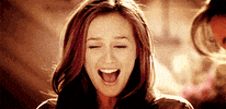 TV gif. Leighton Meester as Blair on Gossip Girl. She sees something that makes her squeal in excitement and she scrunches her nose and brings her hands up to her face.