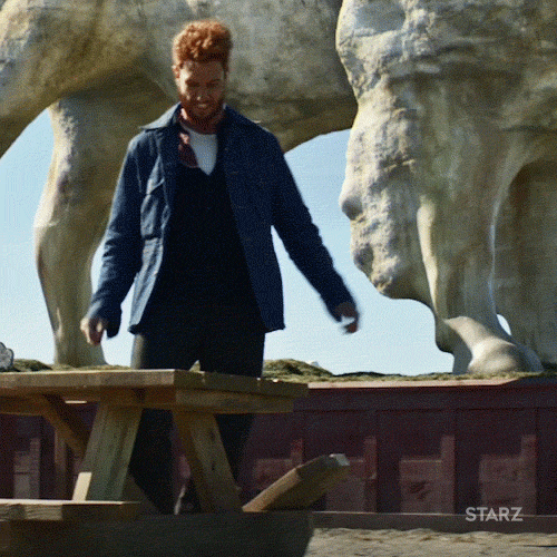 TV gif. Pablo Schreiber as Mad Sweeney on American Gods stomps furiously and passionately on a broken picnic bench seat.