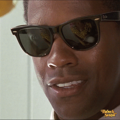 Movie gif. Denzel Washington as Xavier in The Mighty Quinn. We zoom in very close to his face and we watch as his face breaks out into a grin.