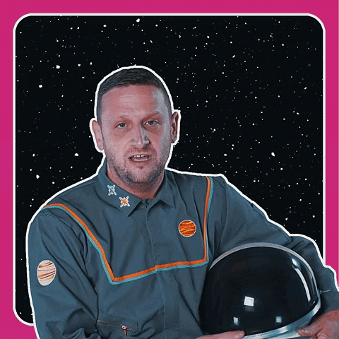 Celebrity gif. Tim Robinson in a gray astronaut suit with his helmet under his arm against a starry space background. He points his finger and looks intently while saying “if you do school people say it’s great.” Bold text reads, "School is cool!"