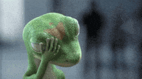 Ad gif. The Geico Gecko is facepalming with his eyes closed. He wipes his hand across his face in frustration.