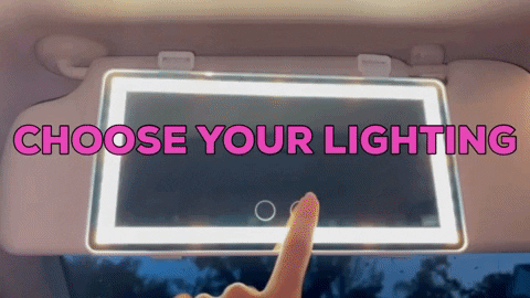 Person using a lighted car mirror
