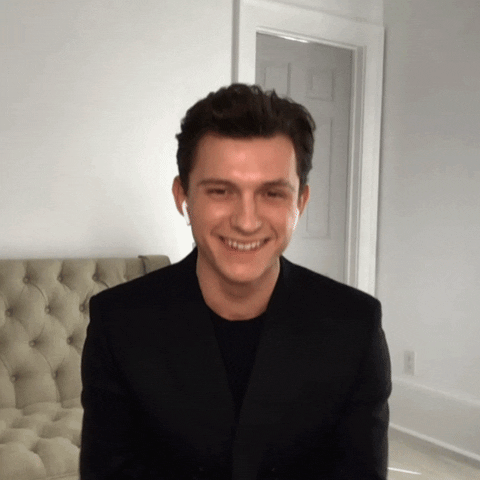 Tonight Show gif. Tom Holland leans back laughing during a video appearance on The Tonight Show Starring Jimmy Fallon about Marvel's Spiderman.
