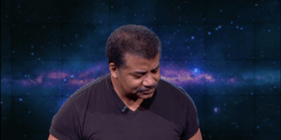 Celebrity gif. Neil Degrasse Tyson stands in front of an outer space background as he raises a hand over his head and looks ahead. Text, "Can I get an Amen!"