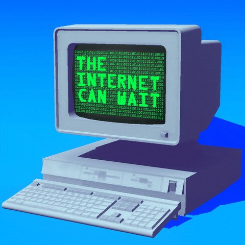 Digital art gif. Screen of a retro gray computer against a blue background reads, “Register to vote. The internet can wait.”