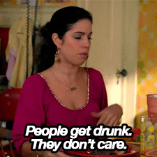 TV gif. Ana Ortiz as Hilda in Ugly Betty, flippantly waving her hand and shaking her head while saying, "People get drunk. They don't care."