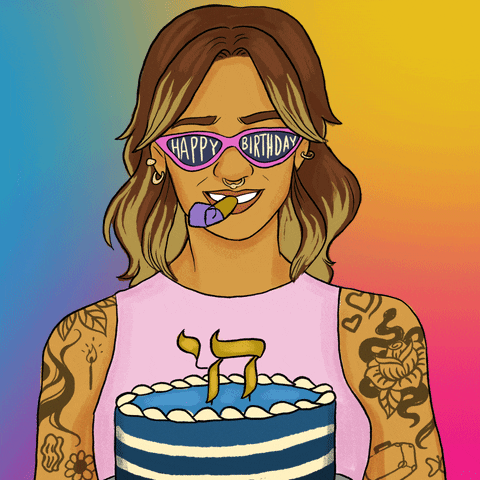 Digital art gif. Ethnically-ambiguous young woman on a rainbow background, with bold highlights, a nose ring, and tattoos, toots a party blower, presenting a blue cake decorated with the Hebrew character for "l'chaim," and wearing cat-eye sunglasses that say "Happy birthday."